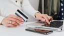 Hands completing a checkout transaction